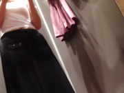 试衣间暗藏摄像头偷拍黑丝长裙女神换衣服还臭美拿手机自拍两张